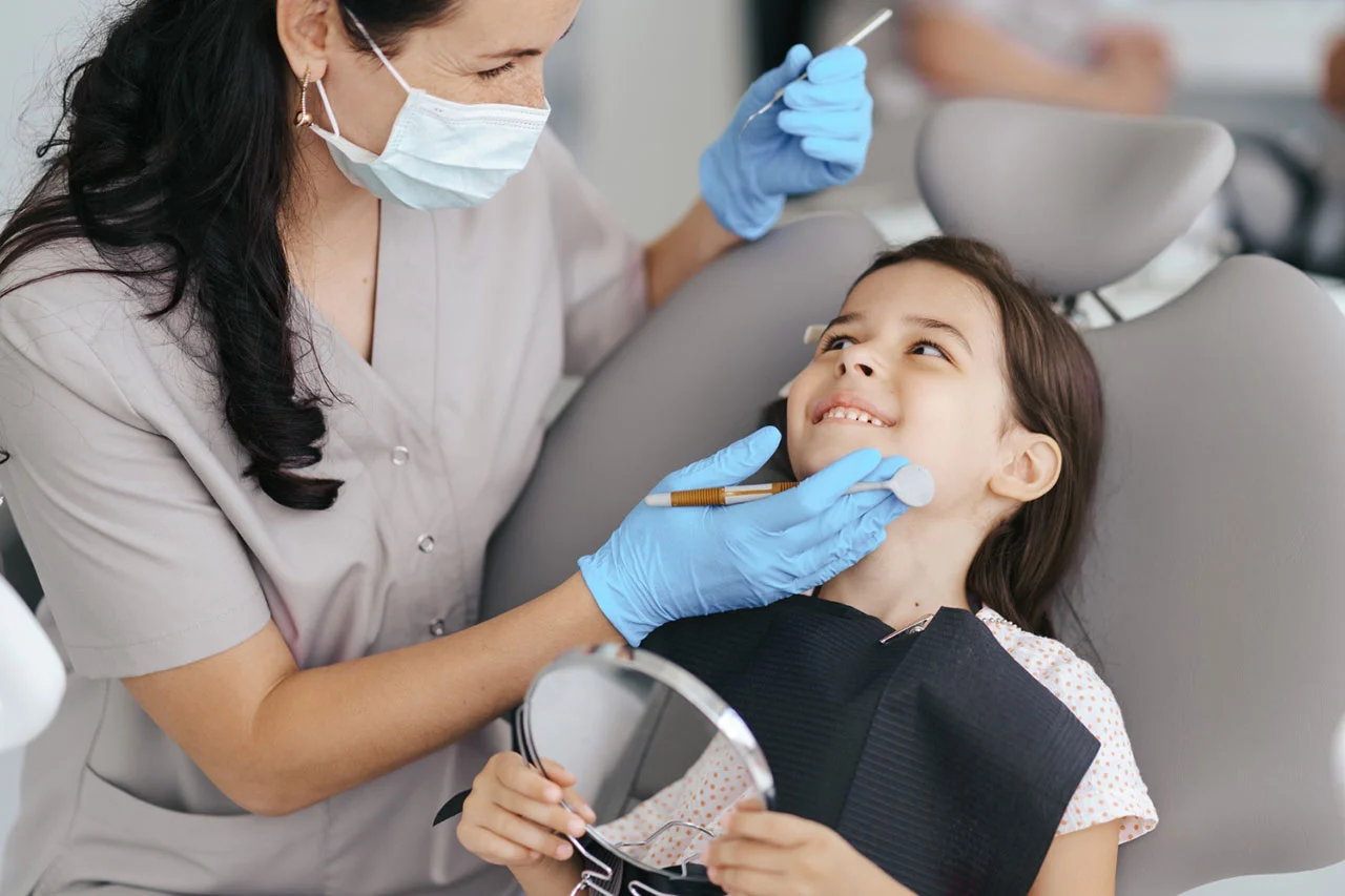 Dentist performing a check-up on a patient