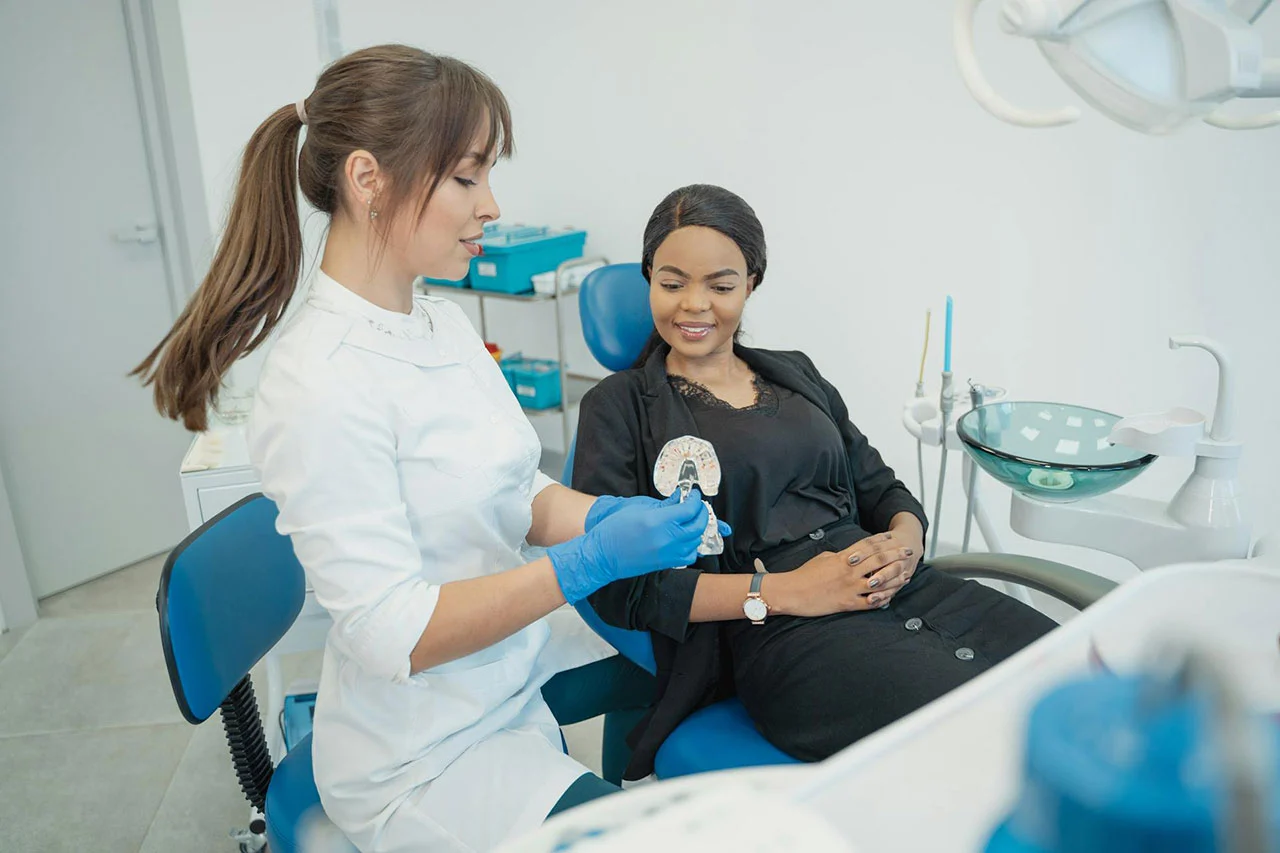 Dentist assisting a patient with dental care