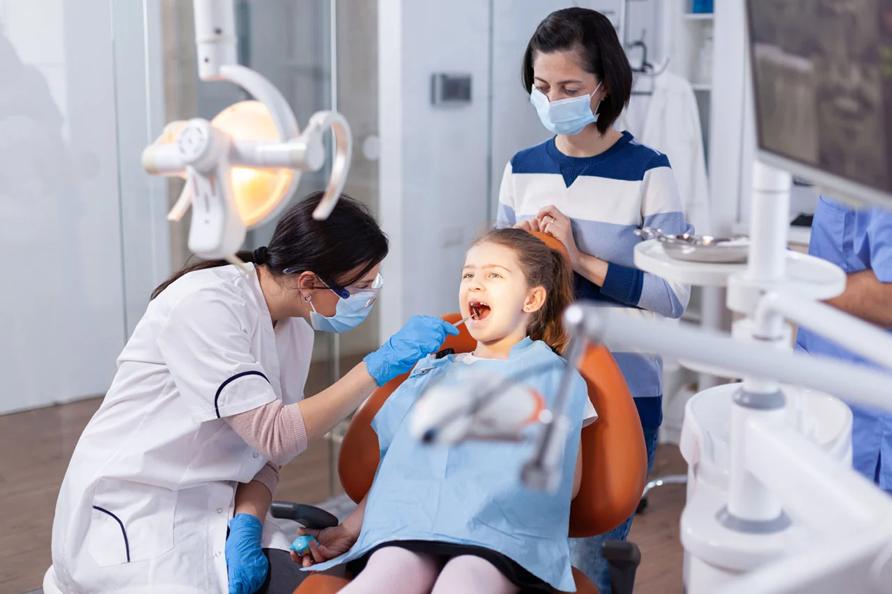 Dentist performing a check-up on a patient